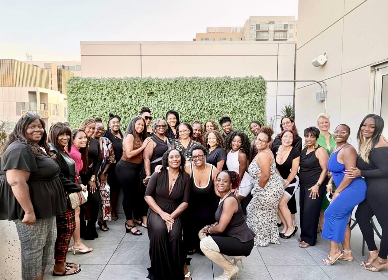 A large group of WEPN women gathered on a rooftop